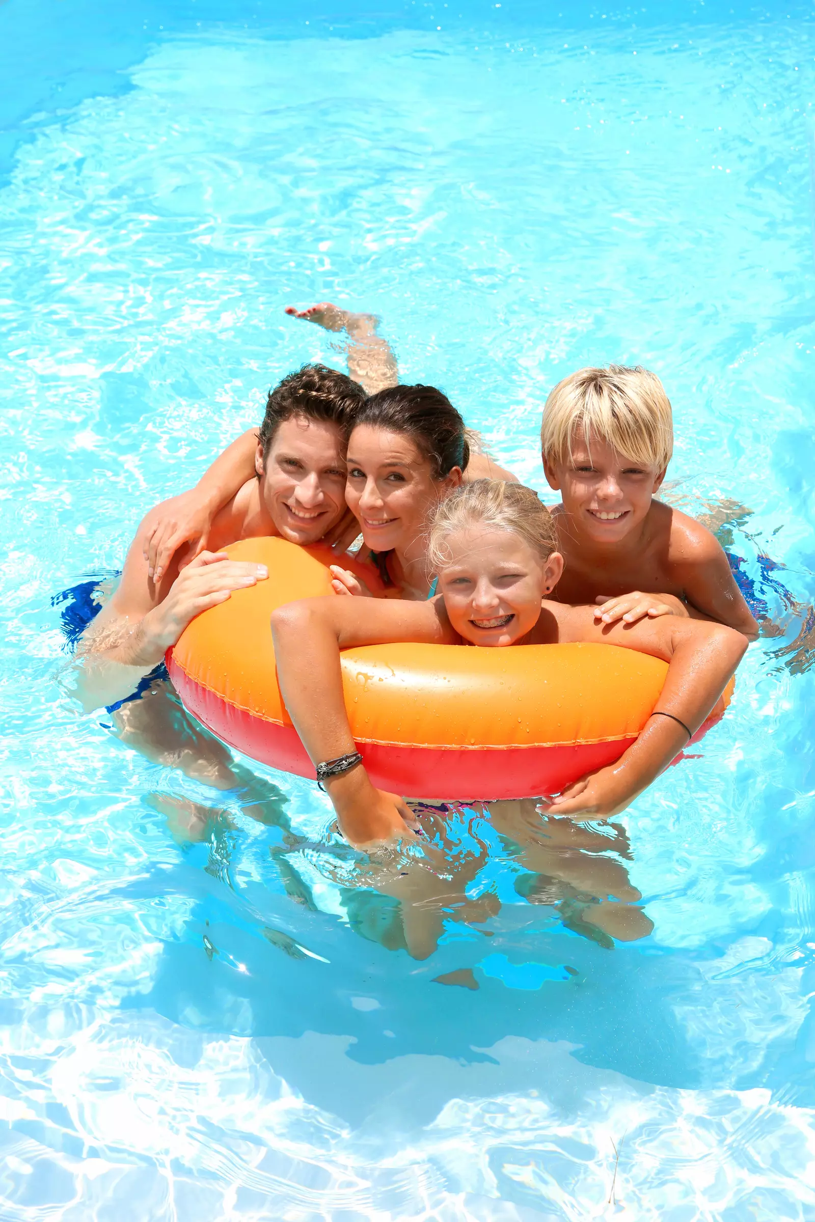 family in swimming pool
